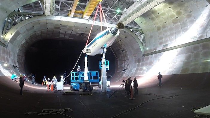 Arnold Engineering Development Complex team members lower the NASA/Army Tiltrotor Test Rig into the 40- by 80-ft wind tunnel in the AEDC National Full-Scale Aerodynamics Complex at Moffett Field in Mountain View, California