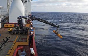 Operators aboard Australian navy vessel Ocean Shield launching an underwater vehicle to search for the missing Malaysia Airlines Flight 370 