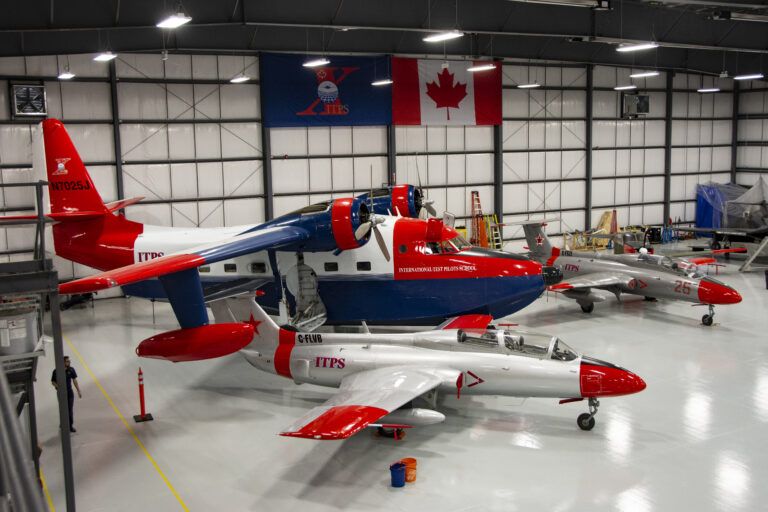 he HU-16 Albatross twin–radial engine amphibious seaplane in the hangar with the Aero L-29 Delfín military jet trainer