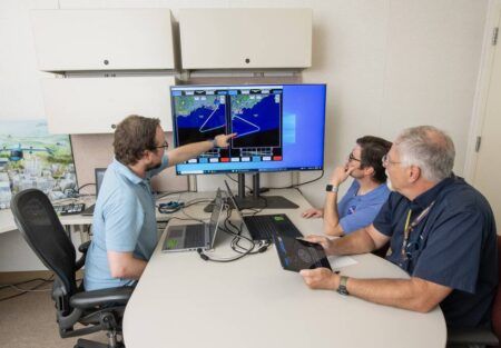 working on a flight plan at a computer