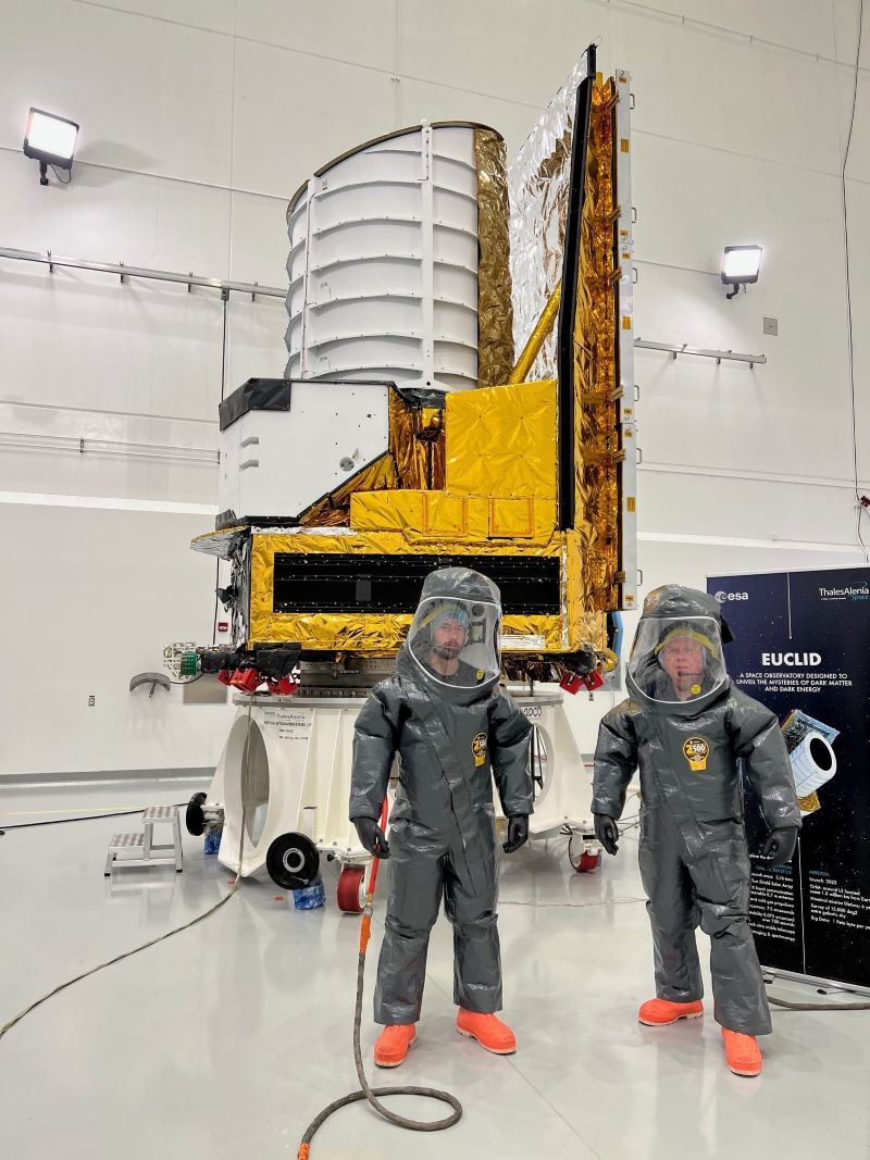 engineers stand in front of a launcher