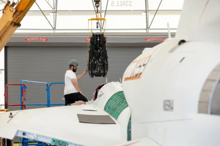 NASA Life Support Technician Mathew Sechler provides support as the X-59’s ejection seat is installed into the aircraft at Lockheed Martin Skunk Works’ facilities in Palmdale, California. Completion of the seat’s installation marks an integration milestone for the aircraft as it prepares for final ground tests. Lockheed Martin