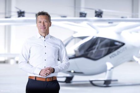 Executive in front of an eVTOL