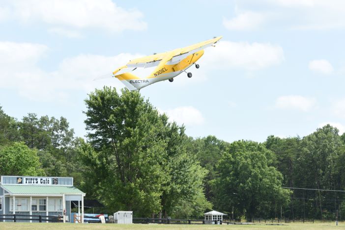 Yellow aircraft taking off