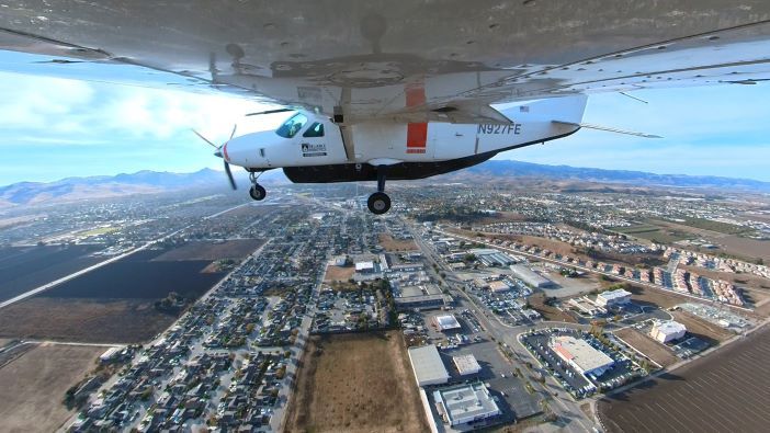 under the wing of an aircraft