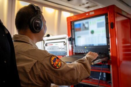 Flight test engineer at a computer during the Pearl 10X trials