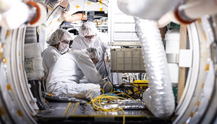 Engineers testing a spacecraft