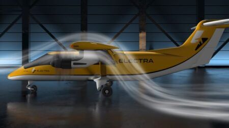 Electra EL9 hybrid-electric aircraft with yellow and white livery showing blown wing configuration with electric motors and propellers