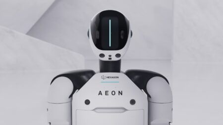 White and black humanoid robot with AEON branding on chest and glowing blue light strip on head