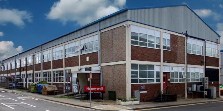 Honeywell's Yeovil facility in England showing the main manufacturing building with brick and concrete construction and multiple industrial sections