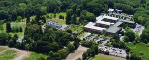 Aerial view of Roke's headquarters facility showing modern buildings surrounded by green landscape Roke's headquarters facility where the company develops defense and national security solutions including the ZODIAC battlefield intelligence
