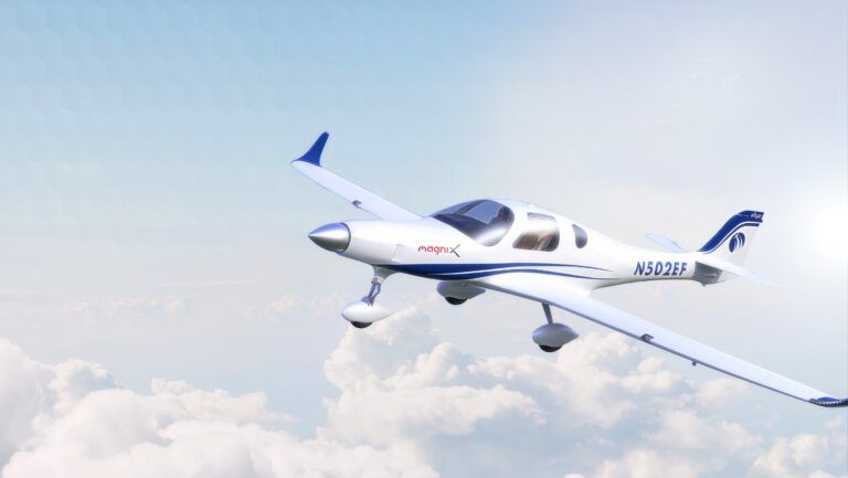 Bye Aerospace selects magniX batteries for eFlyer 2 prototype White and blue two-seat electric training aircraft with magniX branding in flight against blue sky