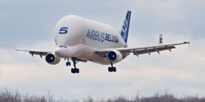 A large cargo plan against a grey sky