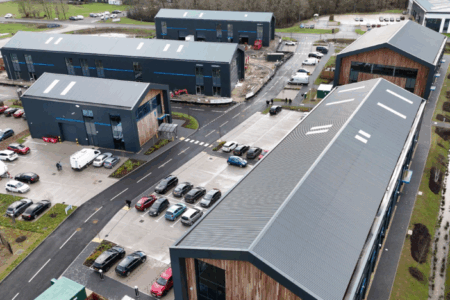 Aerial view of the Westcott Space Hub campus showing multiple modern industrial buildings with parking facilities