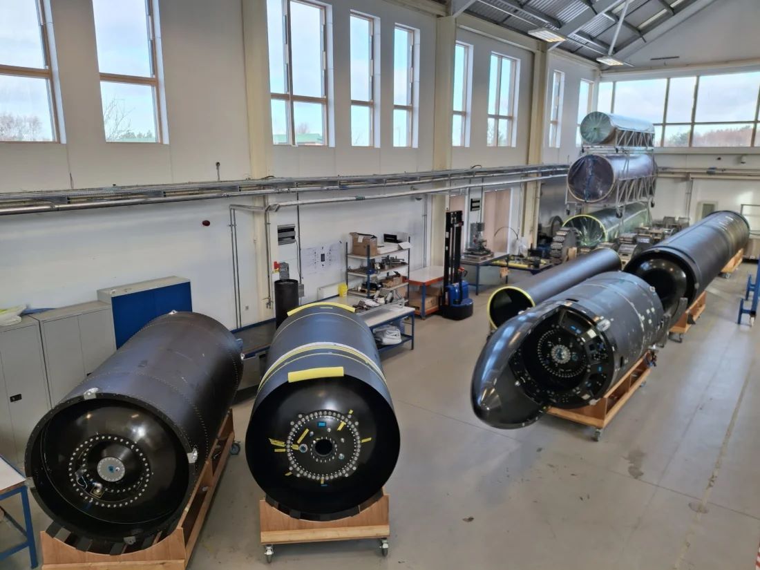 Close-up of the Orbex Prime microlauncher second stage and fairing in near-flight configuration inside an assembly hall
