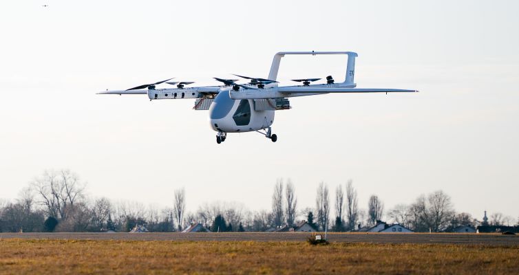 ERC System Romeo eVTOL prototype in hover flight over an airfield with eight rotors deployed