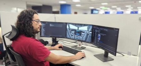 Rapita Systems and Avionyx partner on avionics certification An engineer works at a multi-monitor workstation displaying avionics software development and cockpit simulation environments