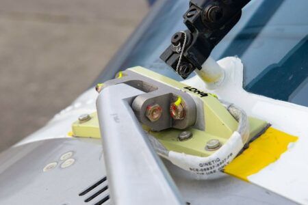 Titanium hinge manufactured from recycled material fitted to QinetiQ's Agusta A109S helicopter at MoD Boscombe Down