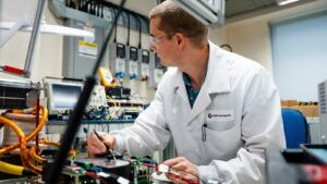 A Collins Aerospace engineer tests electronic power distribution components for the HECATE program at the company's Solihull facility