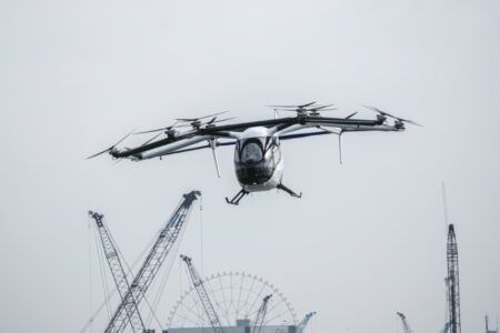 Skyports deploys vertiport automation system during Tokyo eVTOL demos SkyDrive SD-05 eVTOL aircraft in flight over Tokyo Bay