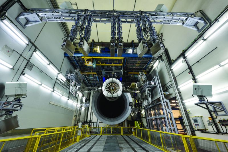 et engine mounted in a Safran indoor test cell at Villaroche, France, with overhead instrumentation rig and gantry walkway in foreground
