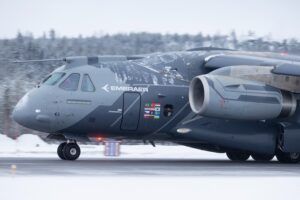 Embraer KC-390 Millennium military transport aircraft on a snow-covered runway during cold weather trials in northern Sweden