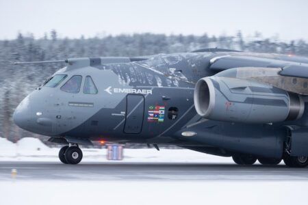 Embraer KC-390 Millennium military transport aircraft on a snow-covered runway during cold weather trials in northern Sweden