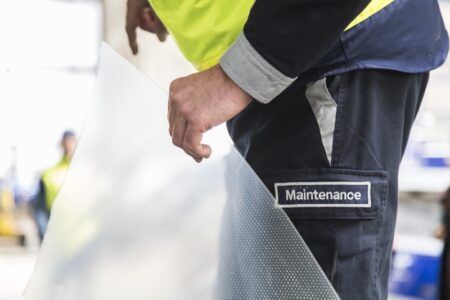 Airbus and Lufthansa to cover A330 wings with Aeroshark material Maintenance technician holding a section of perforated Aeroshark riblet film