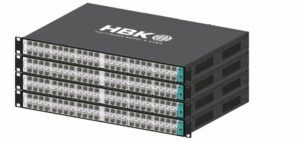HBK Fusion MX data acquisition units stacked in a rack-mount configuration, showing front-panel connector arrays and teal-accented blade modules