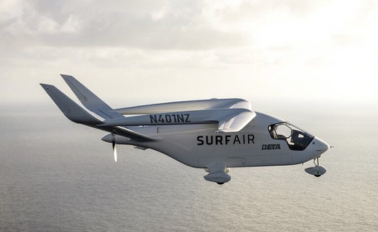 BETA Technologies Alia CTOL electric aircraft in flight over ocean, with Surf Air and BETA logos visible on fuselage, registration N401NZ