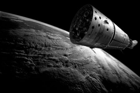 A spacecraft capsule in orbit above the cloud-covered curvature of Earth