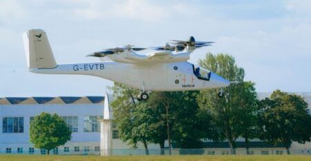 Vertical Aerospace full-scale eVTOL prototype G-EVTB in low hover during first piloted flight at Cotswold Airport, Gloucestershire, UK