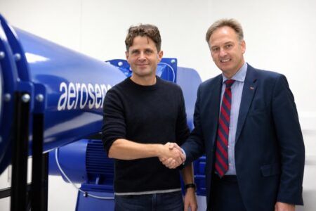 Evolution Measurement Group partners with Aero Sensor on flow probes Barney Garrood of Aero Sensor and Paul Crowhurst of Evolution Measurement Group shaking hands in front of an aerosensor-branded flow probe rig
