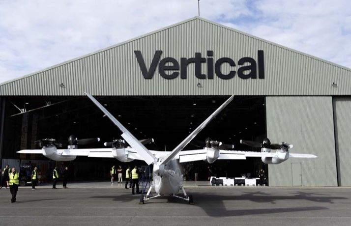 Vertical Aerospace's Valo electric air taxi outside the company's hangar at Cotswold Airport, with staff standing around it