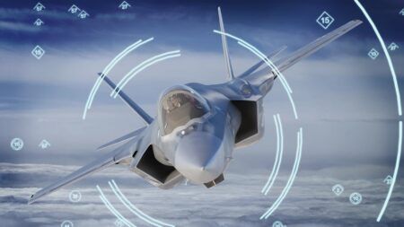 A computer rendering of an F-35 Lightning II stealth fighter banking in flight above clouds, overlaid with circular sensor-style graphics