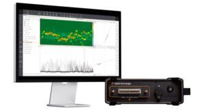 Eddyfi Technologies Ignite instrument beside a computer monitor displaying a green C-scan with red indications above signal trace and impedance plots
